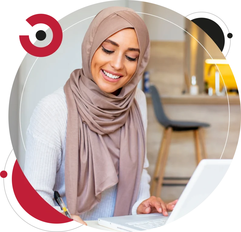 Pretty woman wearing hijab in front of laptop search and doing office work.